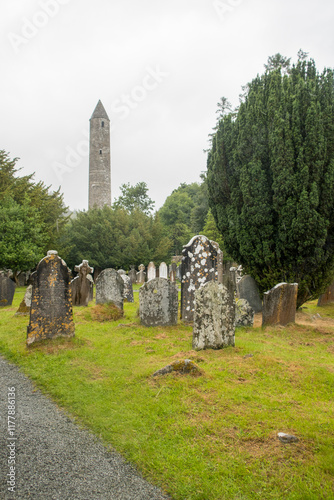 Round Tower Looming Over Historic Graveyard photo