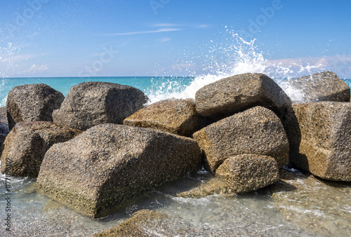 Fototapeta Naklejka Na Ścianę i Meble -  Sand beach with breakwaters, Spadafora, Sicily, Italy