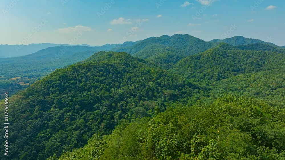 A serene aerial view of a large Buddha statue surrounded by lush forest, with a stunning sunrise casting vibrant hues over a misty mountainous landscape in the background. beautiful sky at sunrise. A serene aerial view of a large Buddha statue surrounded by lush forest, with a stunning sunrise casting vibrant hues over a misty mountainous landscape in the background. beautiful sky at sunrise.
