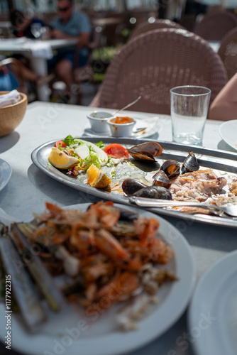 The remains of a fish and seafood lunch photo