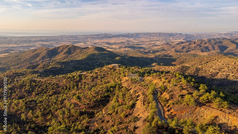 Obraz premium Aerial view of mountainous landscape at sunset.