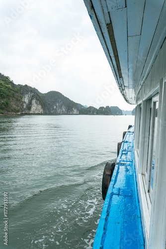 Cat Ba Island, Vietnam. Blue Boat in Halong Bay photo