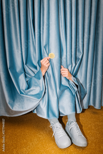 Creative Conceptual Image of Feet Hidden Behind Blue Curtains photo