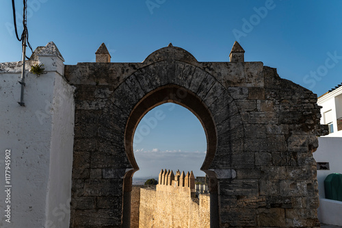 Arabic archway overlooking fortress wall photo