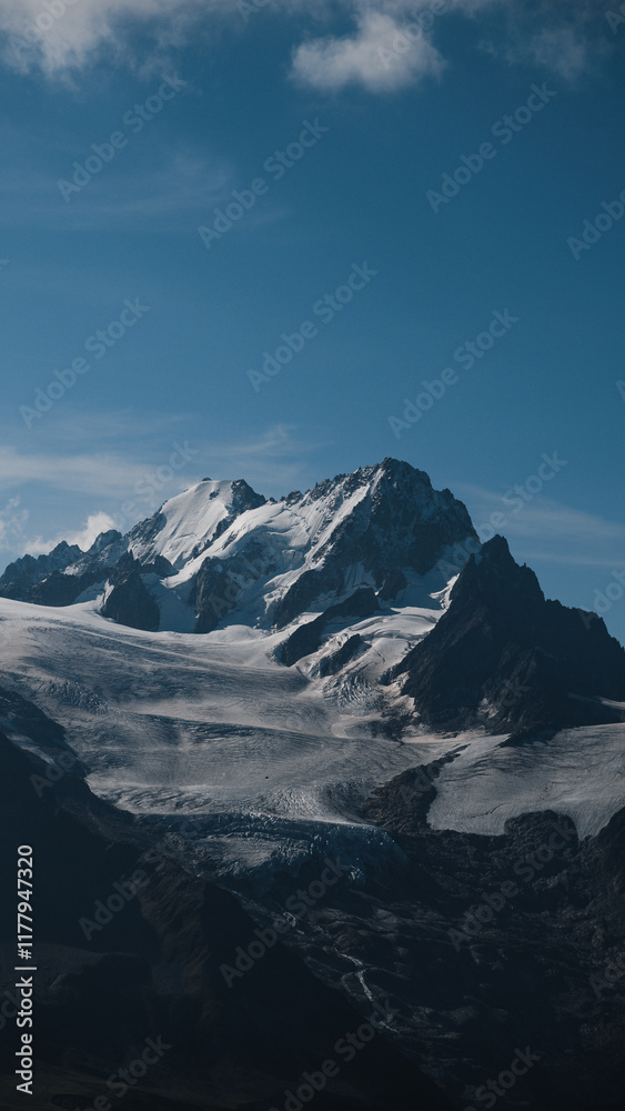 Snow-covered peaks of the Aiguille de Argentière rising over glaciers in the French Alps Snow-covered peaks of the Aiguille de Argentière rising over glaciers in the French Alps