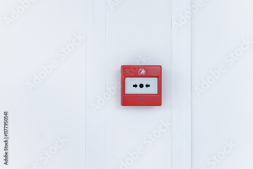 Emergency button on white wall