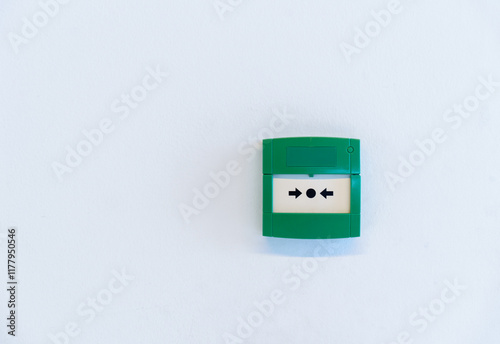 Emergency button on white wall
