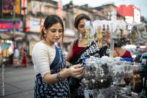 fashionable Indian woman buying fashion accessories in the street  photo