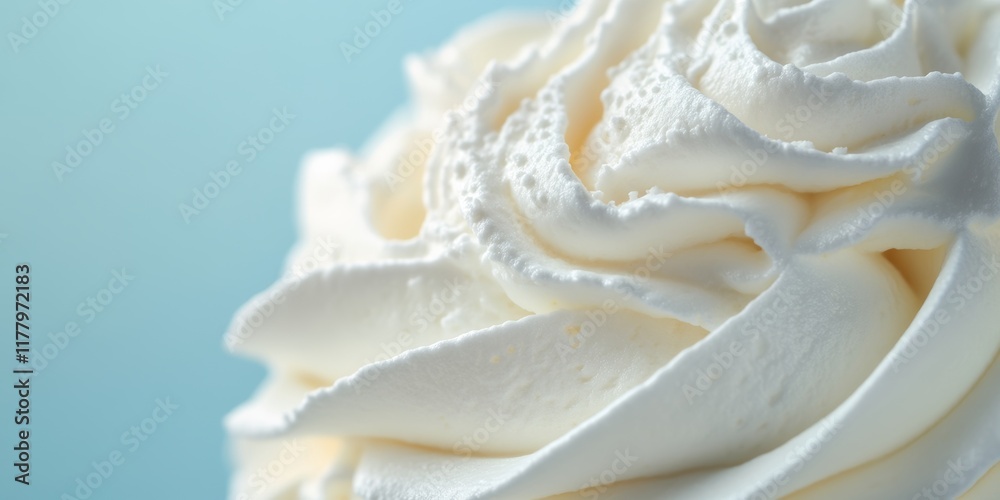 Whipped Cream Swirl Top Close Up Detail Against Pastel Blue Background - Perfect for Dessert or Bakery Promotions Whipped Cream Swirl Top Close Up Detail Against Pastel Blue Background - Perfect for Dessert or Bakery Promotions