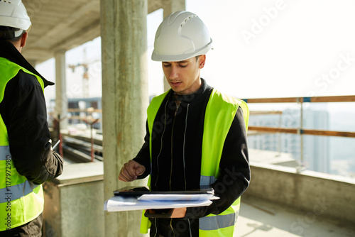 Young engineer uses a tablet photo