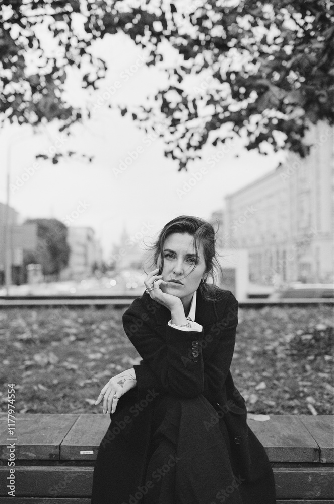 Contemplative Woman in a City Park During Autumn Contemplative Woman in a City Park During Autumn