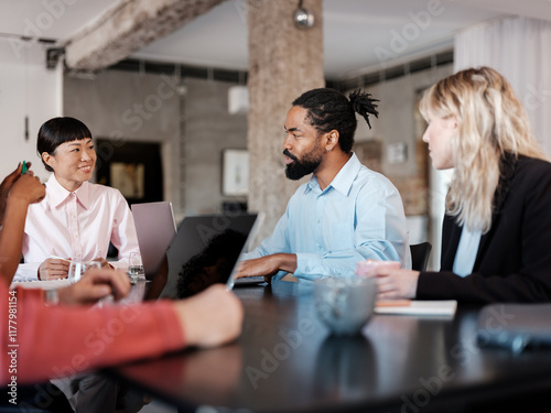 Diverse Team Engaged in Productive Office Meeting Discussion