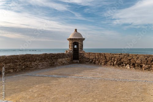 Fort wall with watchtower over the ocean  photo