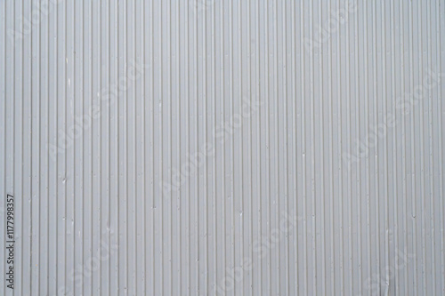 Bilde på lerret Vertical lines of gray paneling form a simple, textured backdrop