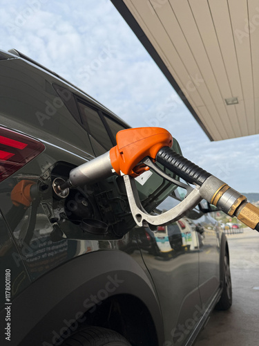 A car is being filled with gas at a gas station