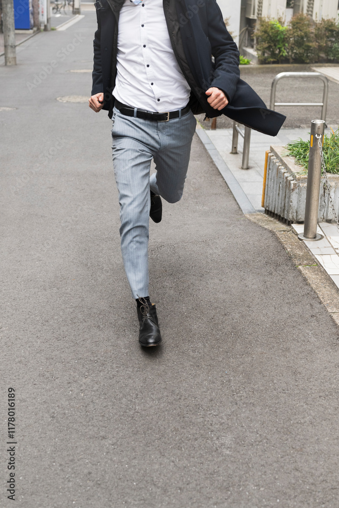Businessperson running on a street Businessperson running on a street