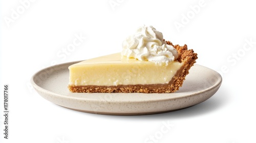 A slice of key lime pie with a graham cracker crust and whipped cream on a white isolated background