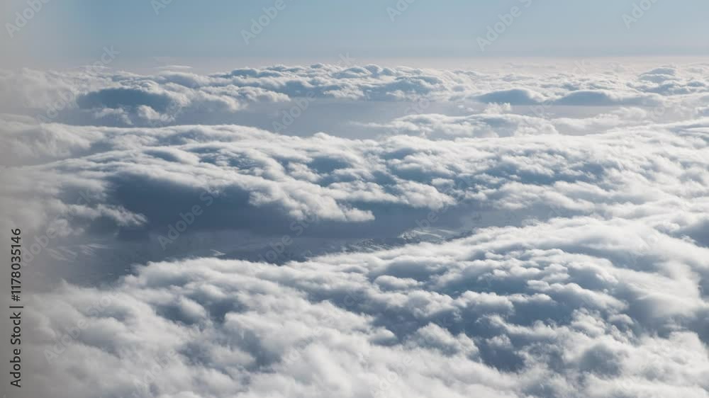 An aerial perspective showcasing soft clouds and a vast sky. Perfect for themes of air travel, serenity, and natural beauty, offering a calm and picturesque view of the atmosphere above. An aerial perspective showcasing soft clouds and a vast sky. Perfect for themes of air travel, serenity, and natural beauty, offering a calm and picturesque view of the atmosphere above.
