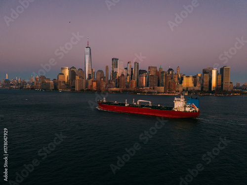 Cargo Ship Near Skyline with dusk Sky photo