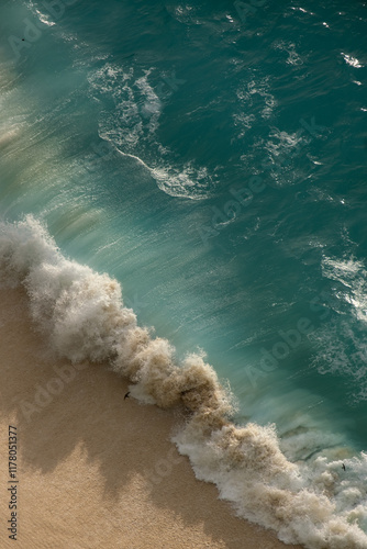 Ocean wave crashing onto a sandy shore