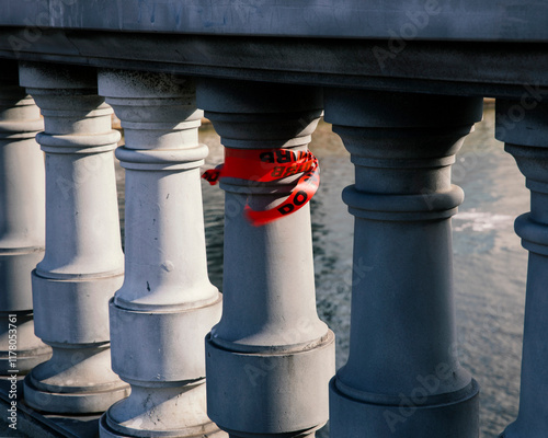 red tape attached to bridge post fluttering in wind