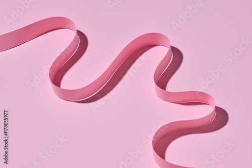 Elegant Pink Ribbon Curves on Pastel Background photo