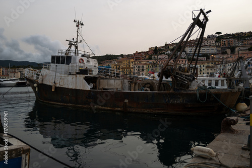 Weathered aged fishing boat photo