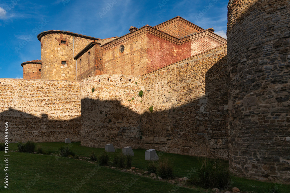 Roman stone walls of the city of Leon and the old prison in the background in a sunny day. Roman stone walls of the city of Leon and the old prison in the background in a sunny day.