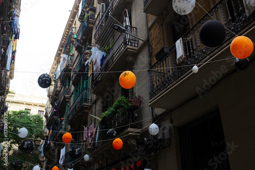 Colourful Halloween party festive decoration balloons on a cozy street photo