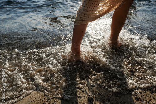 A lady walking near the sea photo