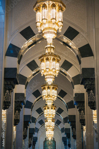 Majestic chandeliers illuminating the sultan qaboos grand mosque photo