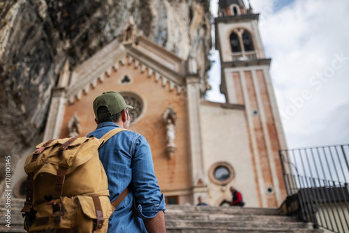 view from below of tourist arriving at the sanctuary of saint madona photo