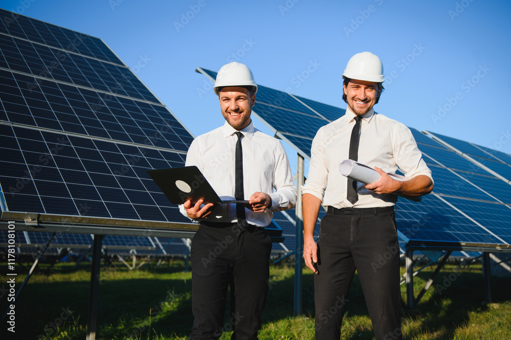 The solar farm, solar panel with two engineers walk to check the operation of the system, Alternative energy to conserve the world's energy, Photovoltaic module idea for clean energy production The solar farm, solar panel with two engineers walk to check the operation of the system, Alternative energy to conserve the world's energy, Photovoltaic module idea for clean energy production