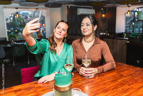 Two Friends Enjoying Wine at a Pub photo