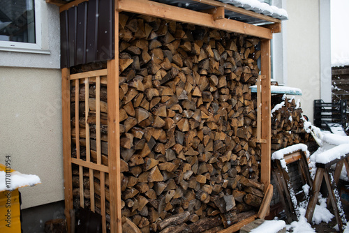 firewood in the woodshed in the yard photo
