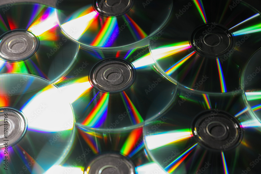 Many shiny compact discs as background, closeup Many shiny compact discs as background, closeup