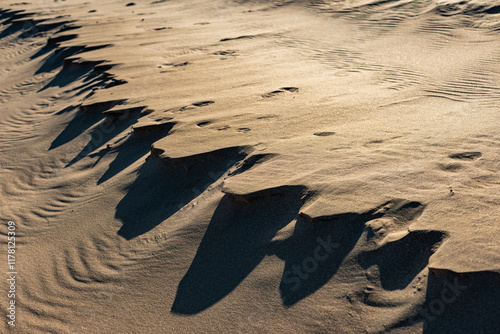 Shadows on sharp sand dune ridges photo