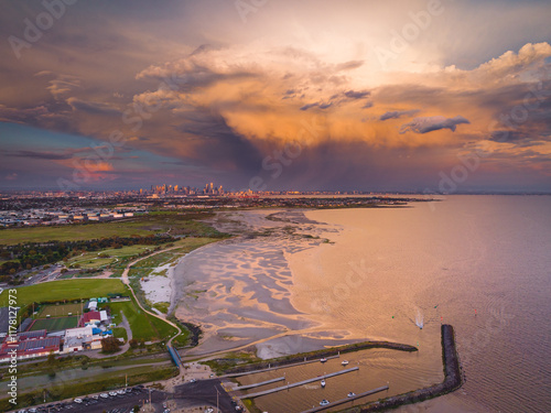 Dramatic storm over bayside coastline photo