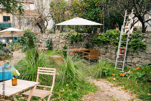 Cozy Outdoor Garden with Wooden Furniture and Umbrella photo