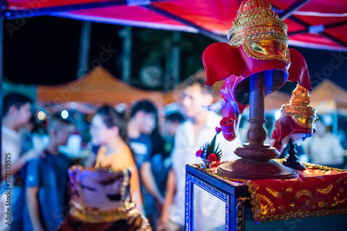 Back View of Sacred Mask Booth at Thai Night Market photo