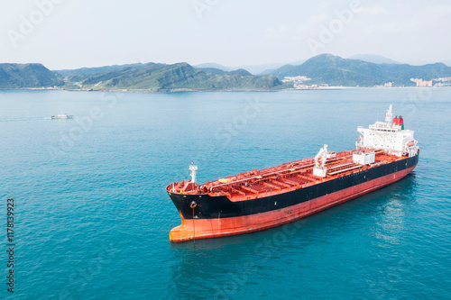 Large Red and Black Oil Tanker in Calm Bay photo