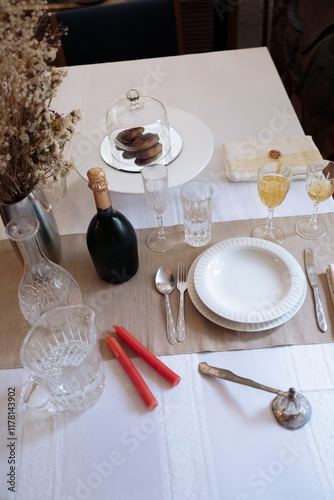 Wedding table setting with champagne and elegant decor photo