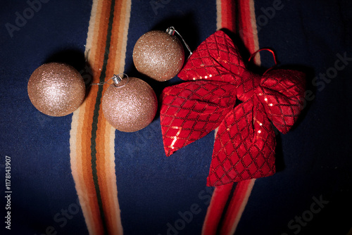 Christmas ornaments and red bow on Alentejo, Portugal wool blanket photo