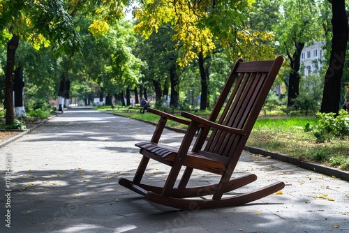 A single wooden deck chair rests on the pavement beneath the trees in the square while an