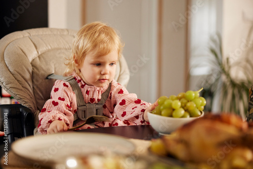 Small girl at the table photo