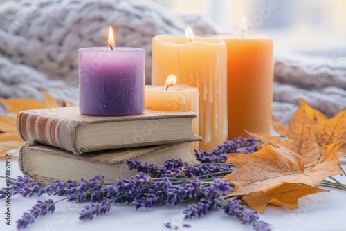 Autumn aesthetic photo featuring candles a book and lavender photo