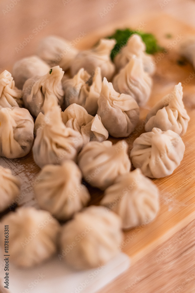 Close-up of freshly made homemade dumplings on a kitchen table Close-up of freshly made homemade dumplings on a kitchen table