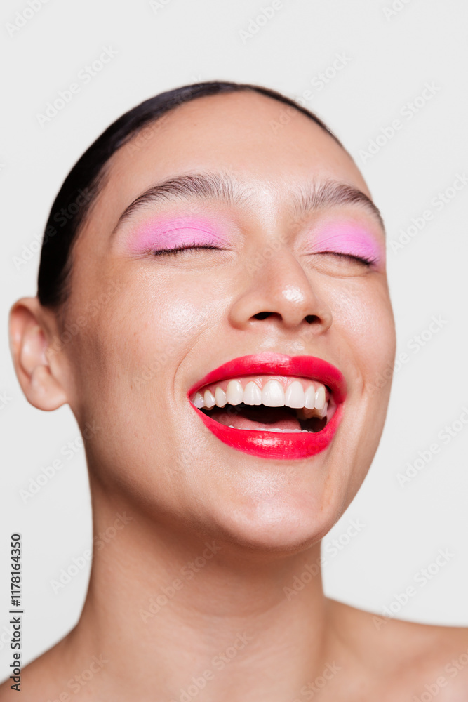 Laughing Woman with Bold Red Lips and Vibrant Pink Eye Makeup Laughing Woman with Bold Red Lips and Vibrant Pink Eye Makeup