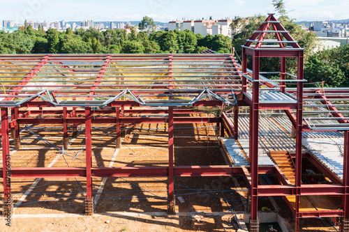 Building Under Construction with Red Steel Frames