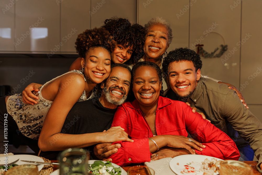 © BONNINSTUDIO/Stocksy - Happy family embracing and smiling during christmas dinner © BONNINSTUDIO/Stocksy - Happy family embracing and smiling during christmas dinner